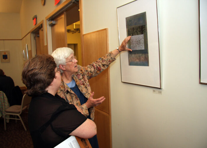 Artist Marion Honors explaining an artwork